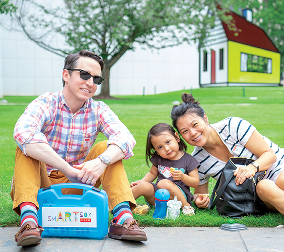 Family sit outside with a smartbox kit