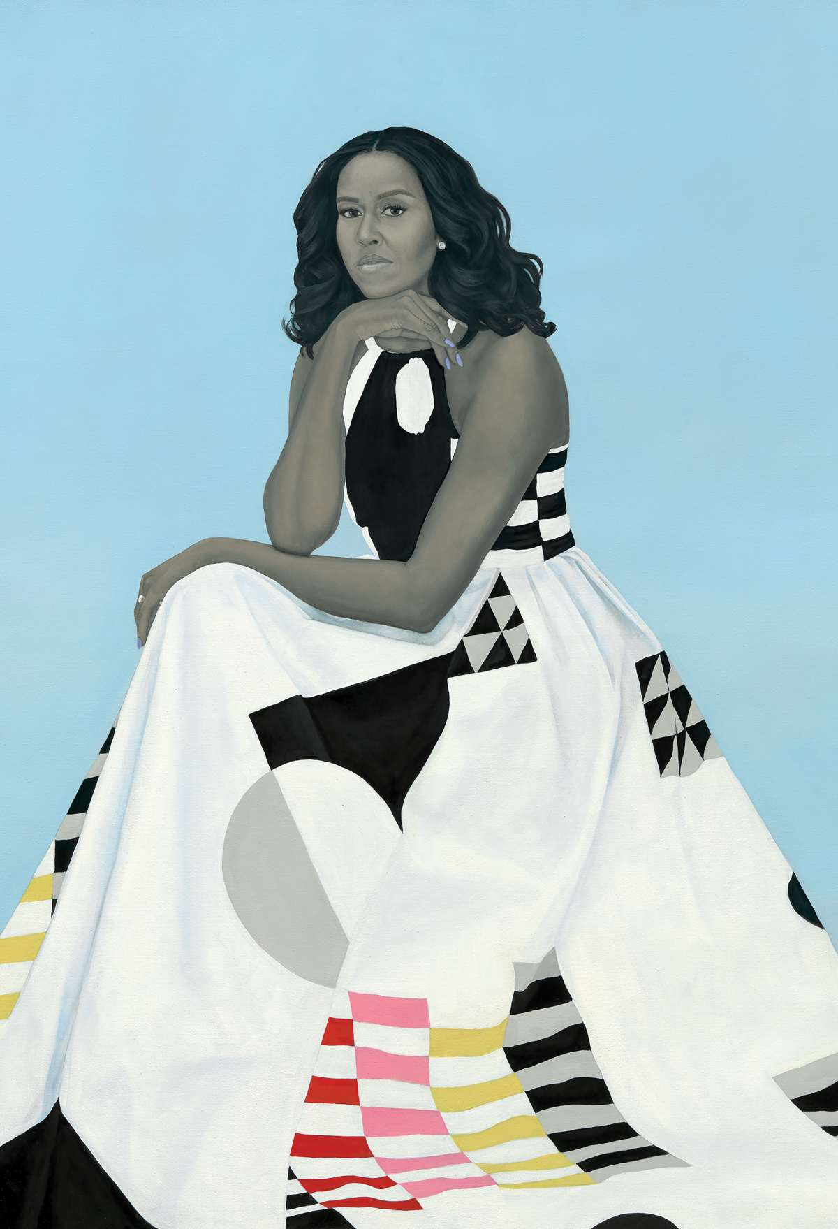 Michelle Obama sits against a light blue background, wearing a long white dress with geometric patterns.