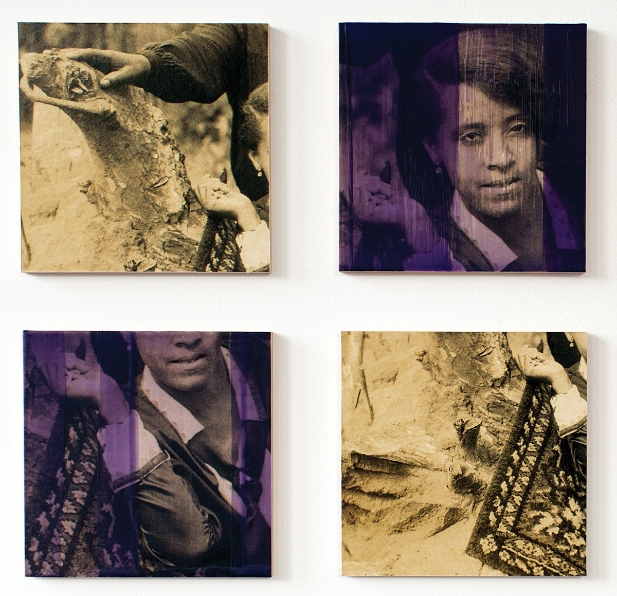 A photograph of two people leaning against a rock is segmented into four squares arranged in a grid with two squares colored by a dark purple wash.