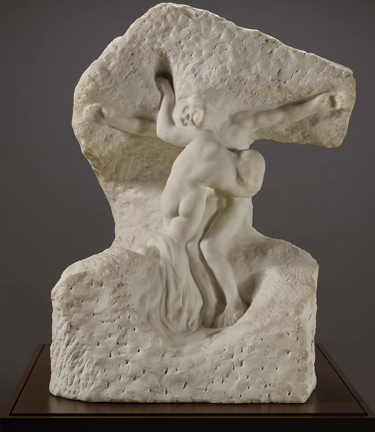 A marble sculpture by Auguste Rodin showing two figures representing Christ and Mary Magdalene.