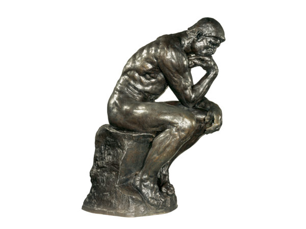 Bronze sculpture of a seated man in profile, his chin resting on his hand.